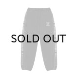 BLACK EYE PATCH (REFLECTIVE STENCIL LOGO TRACK PANTS) BLACK