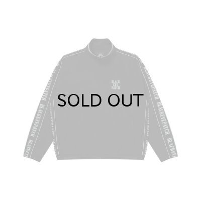 画像1: BLACK EYE PATCH (REFLECTIVE STENCIL LOGO TRACK JACKET) BLACK